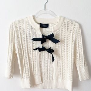 Cream knit cardigan with black bow closure size S NWT